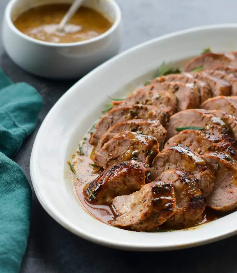 Serving tray of mustard-glazed pork tenderloin.