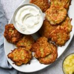 Platter of latkes and sour cream.