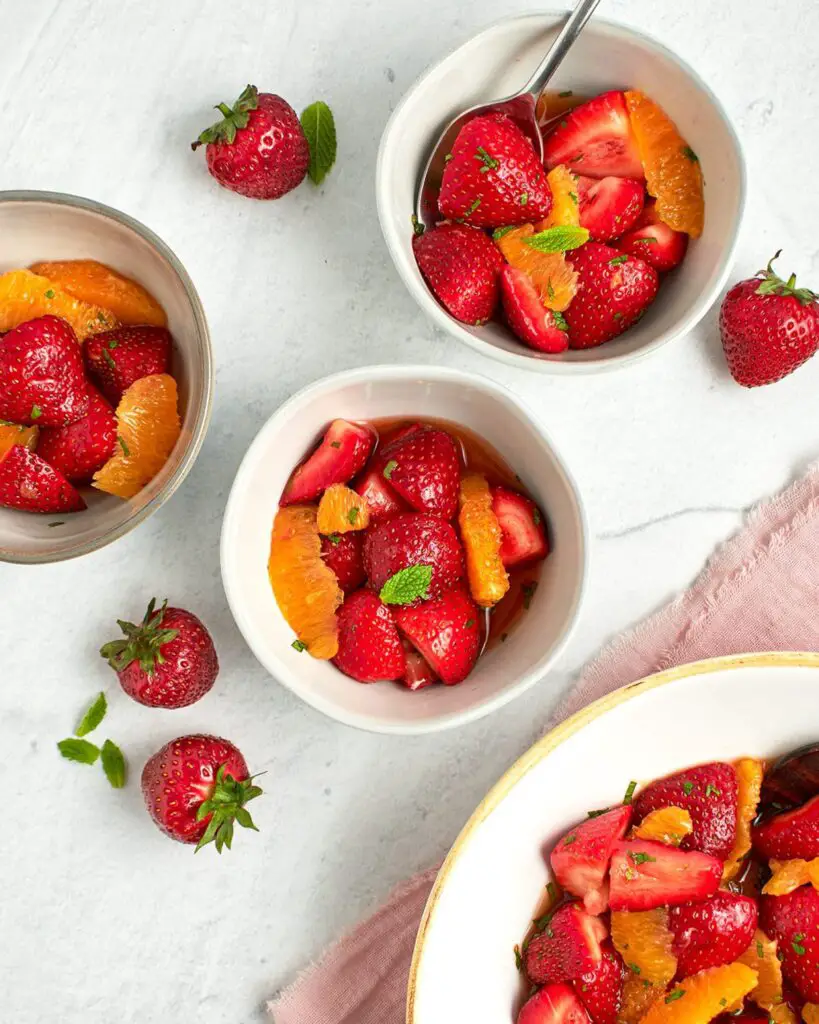 orange and strawberry salad in bowls