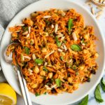 moroccan-spiced carrot and chickpea salad in white bowl.