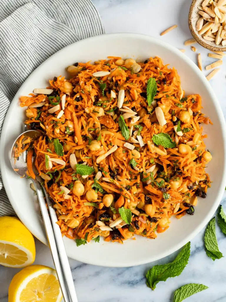 moroccan-spiced carrot and chickpea salad in white bowl.