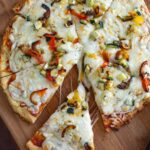 cauliflower pizza crust with roasted veggies